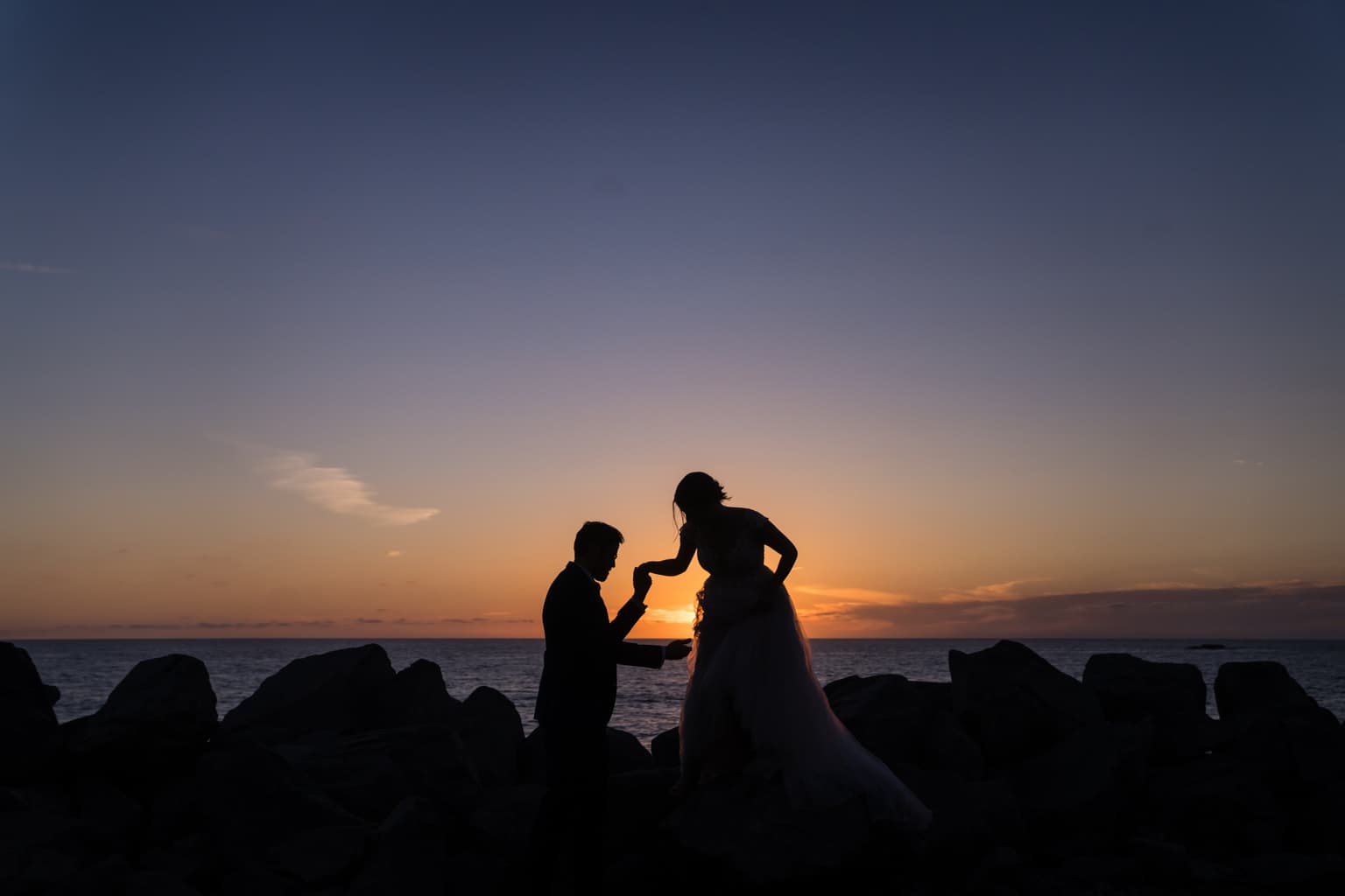 Couple silhouette at sunset California wedding