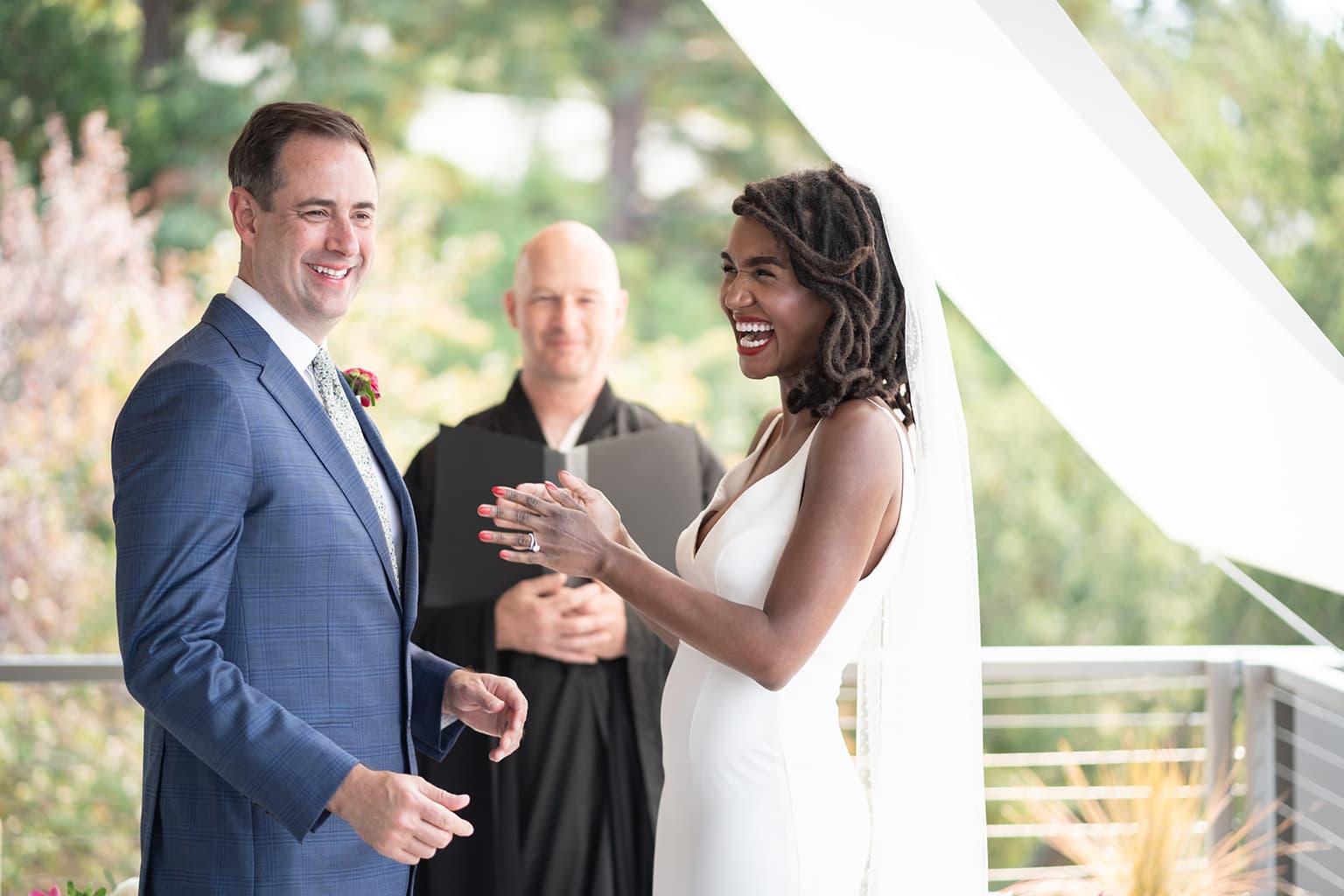 Joyful couple at ceremony — laughter and love