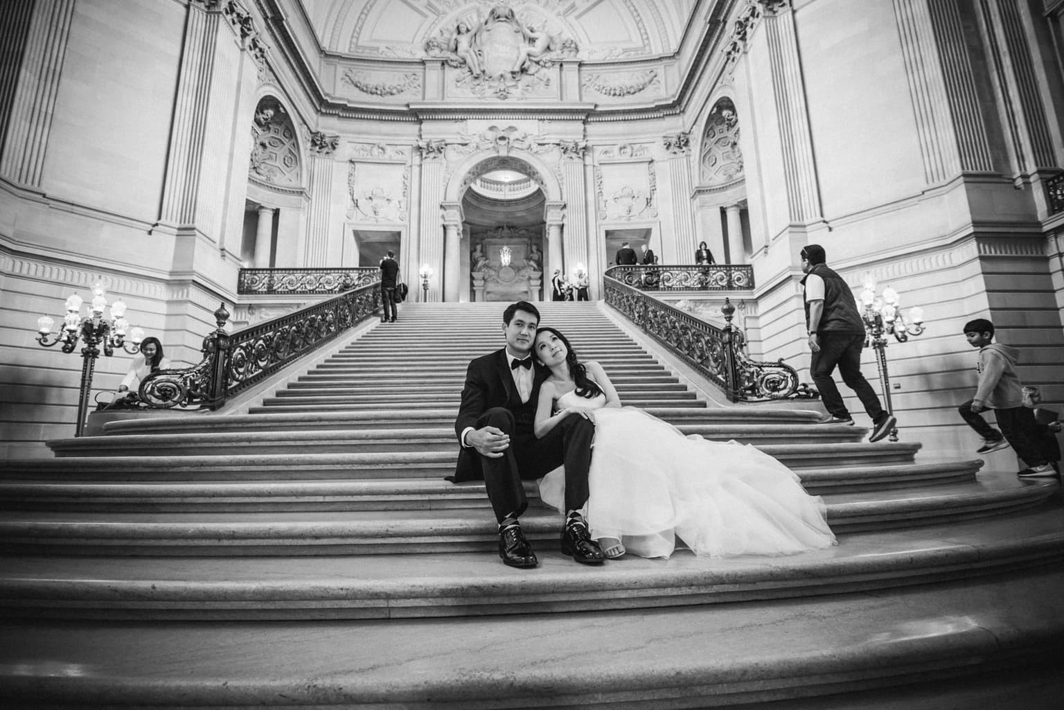 Couple on the grand staircase at San Francisco City Hall