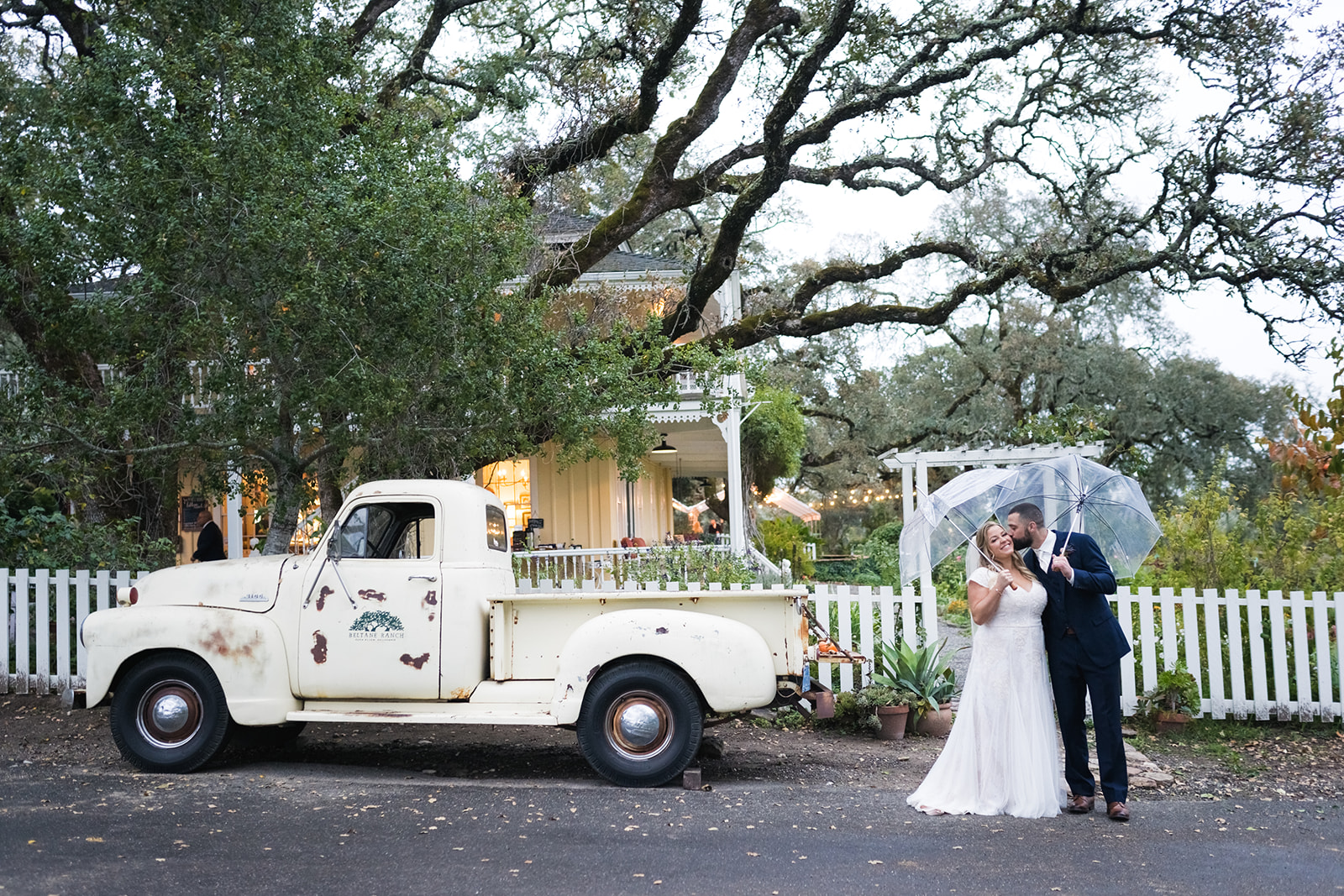 Couple by vintage truck at charming California venue