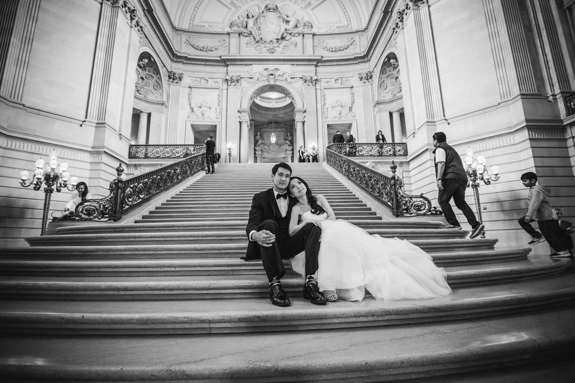 Couple on the grand staircase at San Francisco City Hall